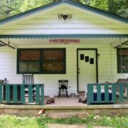 Front porch of the Firefly Farms farmhouse in the summertime.