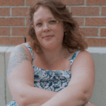 Image is a headshot of Bleah Patterson looking directly at the camera.