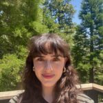 Emma in Lake Arrowhead, California, where she enjoys hiking and paddle boarding in the summer!