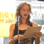 Ariadne Alexis Macquarie reads from a selection of her poems at an open mic event.