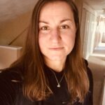 Karen Sherk Chio, a white woman with straight brown hair and brown eyes.