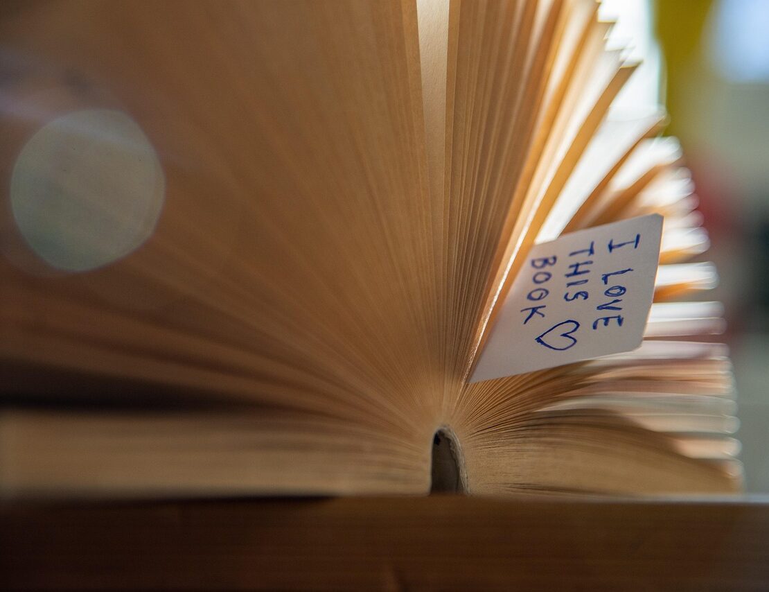 Image of book with bookmark that says I love this book