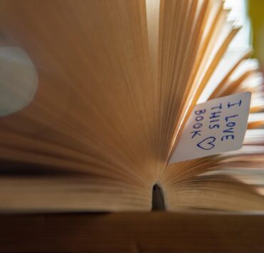 Image of book with bookmark that says I love this book